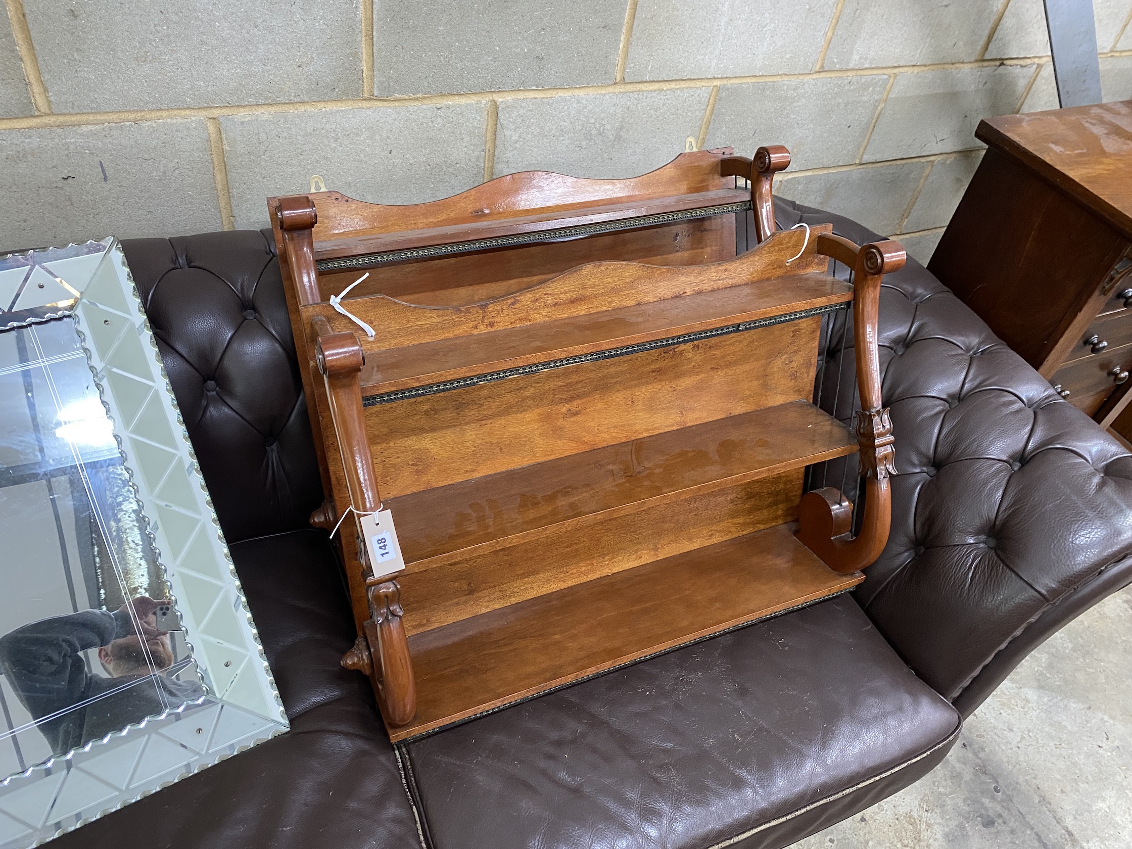 A pair of William IV mahogany three tier wall brackets, width 77cm, depth 23cm, height 64cm